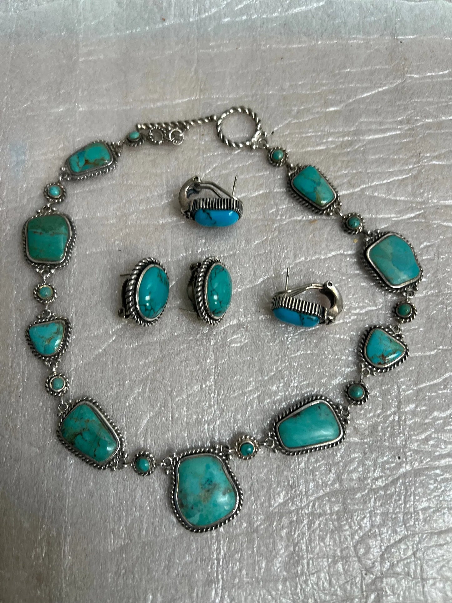 Native American-style sterling silver jewelry featuring prominent turquoise gemstones